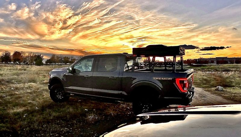 A truck in silhouette against a Baja sunset